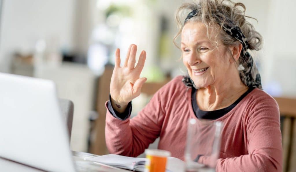 elderly person having an online appointment