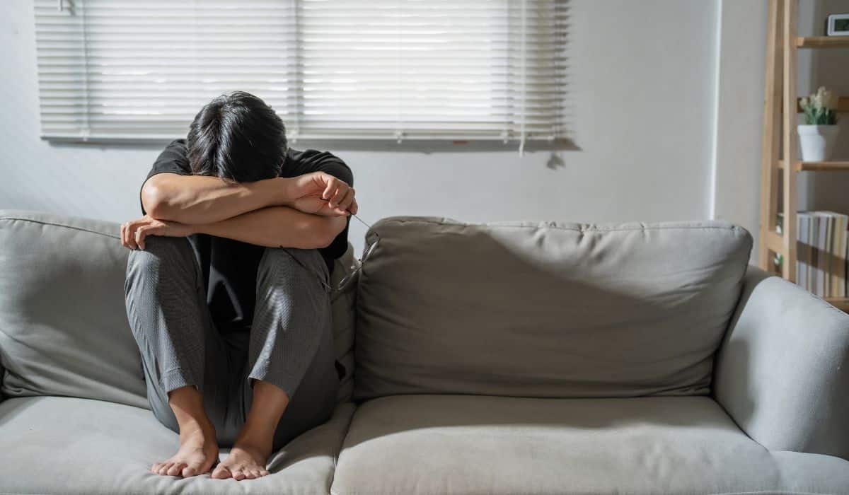 person in living room tired
