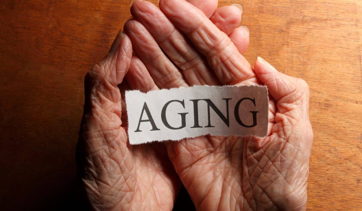 aging sign in hands