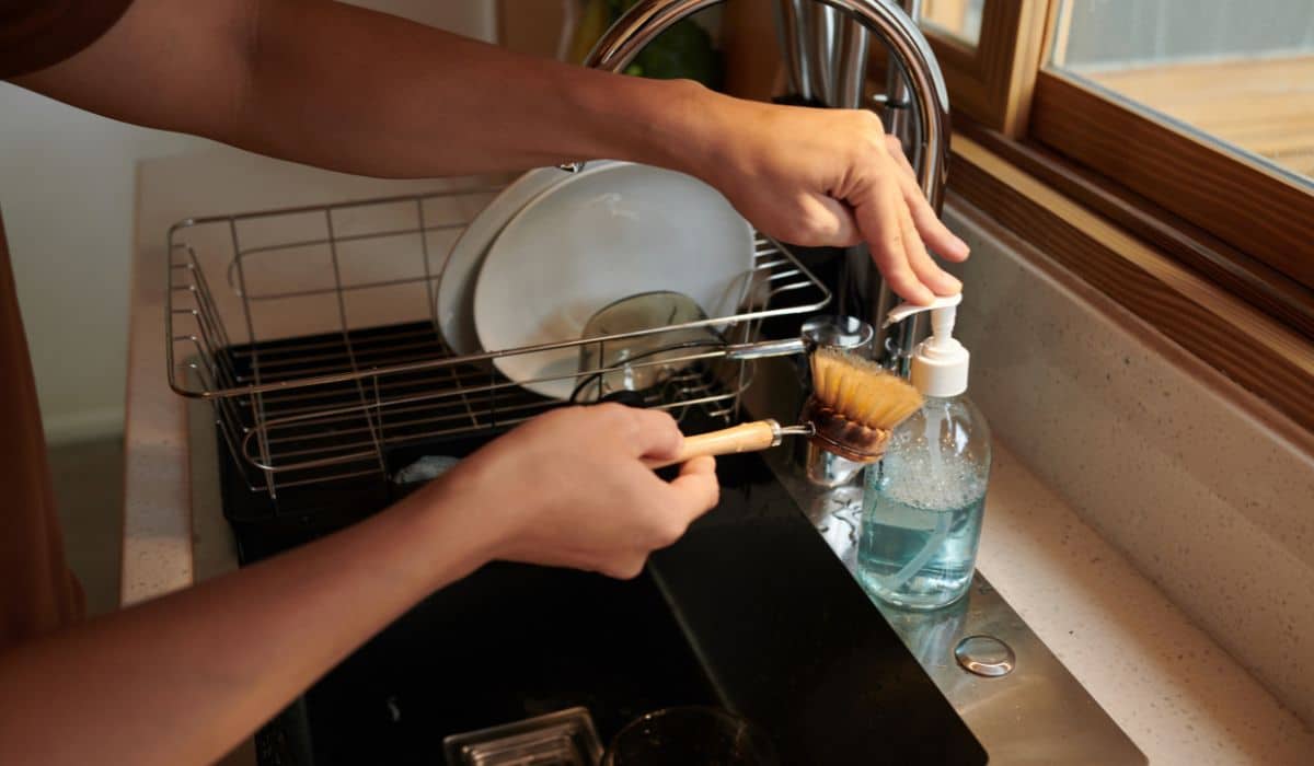 person with ocd washing dishes
