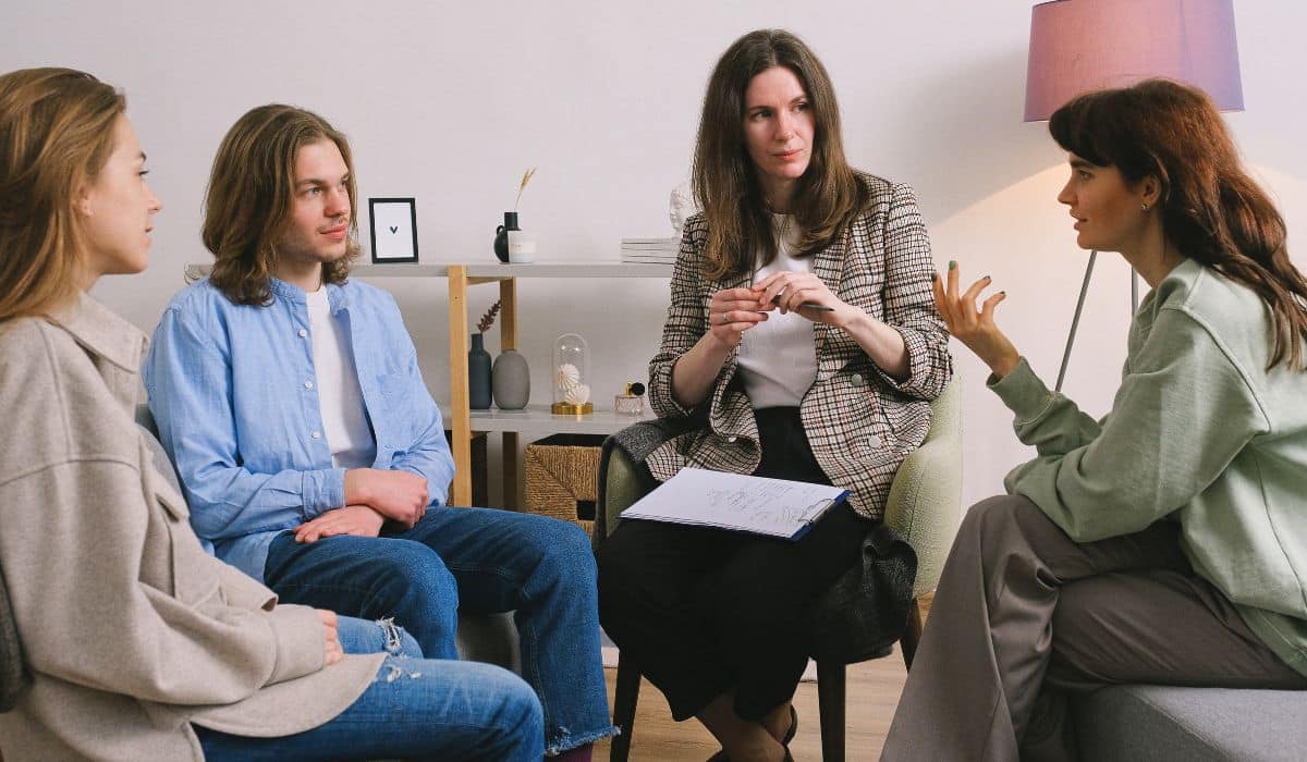 women in a group therapy session