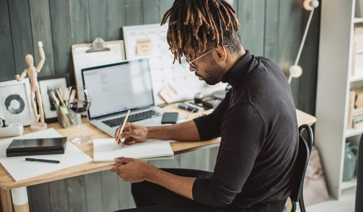 young man working from home at desk
